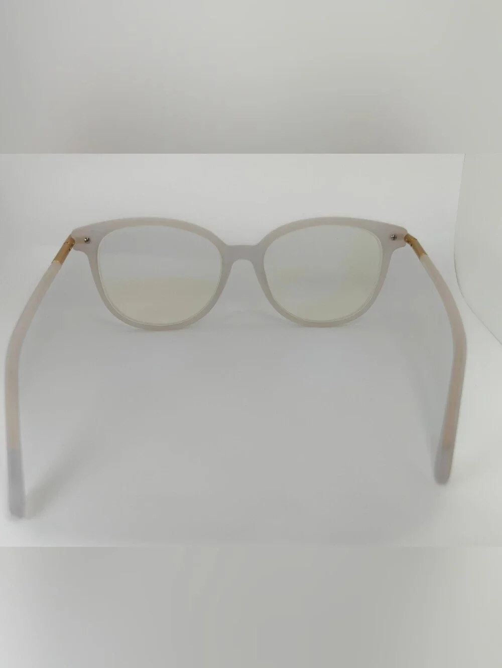 Cylinder. Women's Frosted White Round Frame Glasses. Cylinder Gold Highlights.